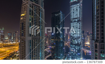 Water canal on Dubai Marina skyline at night timelapse. Water canal on Dubai Marina skyline at night timelapse. 136787389
