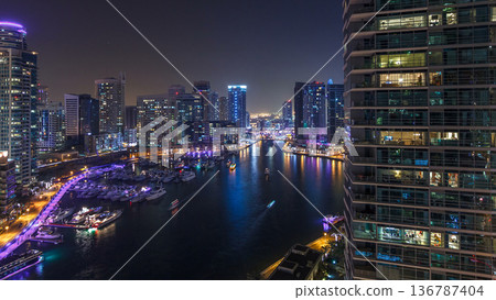 Water canal on Dubai Marina skyline at night timelapse. Water canal on Dubai Marina skyline at night timelapse. 136787404