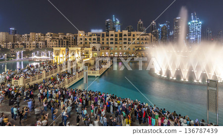 The bridge near the biggest musical fountain in Dubai night timelapse. Dubai, UAE The bridge near the biggest musical fountain in Dubai night timelapse. Dubai, UAE 136787439