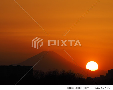 Orange sunset and the silhouette of Mount Fuji Orange sunset and the silhouette of Mount Fuji 136787649