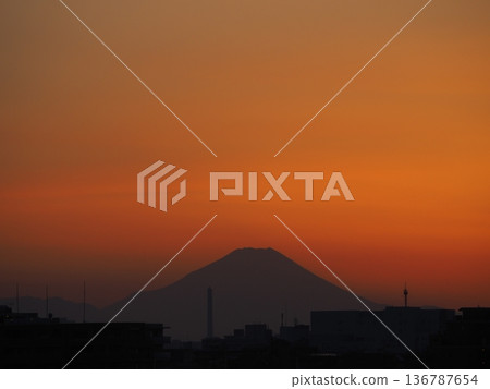 Orange sunset and the silhouette of Mount Fuji Orange sunset and the silhouette of Mount Fuji 136787654