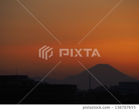 Orange sunset and the silhouette of Mount Fuji Orange sunset and the silhouette of Mount Fuji 136787655