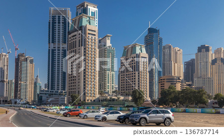 Scenic view of Dubai Marina Skyscrapers with cars timelapse, Skyline, View from sea, United Arab Emirates Scenic view of Dubai Marina Skyscrapers with cars timelapse, Skyline, View from sea, United Arab Emirates 136787714
