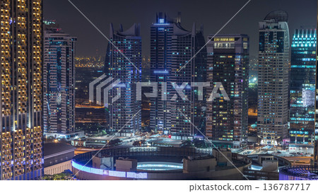 Night illumination of Dubai Marina aerial timelapse, UAE. Night illumination of Dubai Marina aerial timelapse, UAE. 136787717