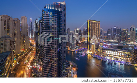 Evening illumination of Dubai Marina day to night aerial timelapse, UAE. 136787725