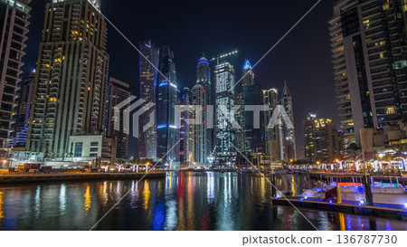 Dubai marina bay with yachts an boats night timelapse hyperlapse Dubai marina bay with yachts an boats night timelapse hyperlapse 136787730