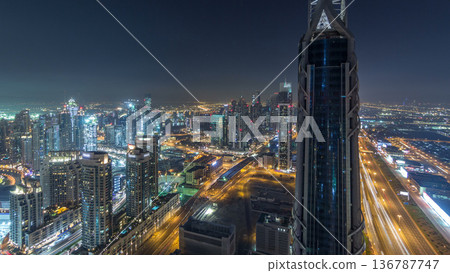 Dubai Downtown night timelapse modern towers panoramic view from the top in Dubai, United Arab Emirates. Dubai Downtown night timelapse modern towers panoramic view from the top in Dubai, United Arab Emirates. 136787747