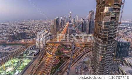 Scenic Dubai downtown skyline day to night timelapse. Rooftop view of Sheikh Zayed road Scenic Dubai downtown skyline day to night timelapse. Rooftop view of Sheikh Zayed road 136787748