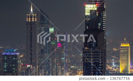 Dubai Downtown night timelapse modern towers panoramic view from the top in Dubai, United Arab Emirates. Dubai Downtown night timelapse modern towers panoramic view from the top in Dubai, United Arab Emirates. 136787756