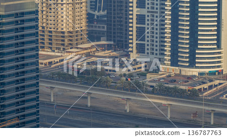 Amazing rooftop view on Sheikh Zayed road surrounded Dubai Marina and JLT skyscrapers timelapse Amazing rooftop view on Sheikh Zayed road surrounded Dubai Marina and JLT skyscrapers timelapse 136787763