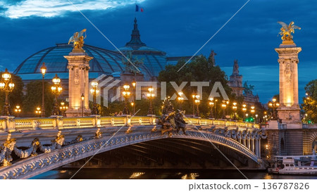 Alexandre Bridge in Paris at night in illumination day to night timelapse. Paris, France Alexandre Bridge in Paris at night in illumination day to night timelapse. Paris, France 136787826
