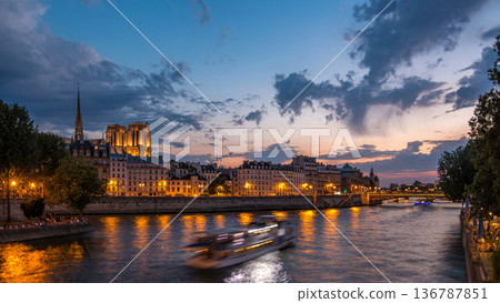 Le Pont D'Arcole bridge after sunset with people and boats day to night timelapse, Paris, France, Europe Le Pont D'Arcole bridge after sunset with people and boats day to night timelapse, Paris, France, Europe 136787851