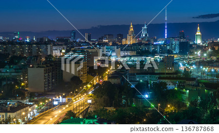 Ostankino tv tower and stalin skyscrapers near railway station night timelapse. Moscow, Russia 136787868