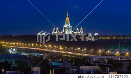 Night cityscape view of Moscow timelapse. View from rooftop to the main building of Moscow State University at night Night cityscape view of Moscow timelapse. View from rooftop to the main building of Moscow State University at night 136787893