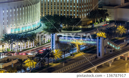 Aerial top view of traffic near mall at night timelapse in Dubai Marina in Dubai, UAE Aerial top view of traffic near mall at night timelapse in Dubai Marina in Dubai, UAE 136787917