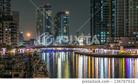 Promenade in Dubai Marina timelapse at night, UAE. 136787918