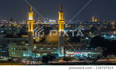 Dubai skyline with Mosque illuminated at night timelapse. Dubai, United Arab Emirates Dubai skyline with Mosque illuminated at night timelapse. Dubai, United Arab Emirates 136787924