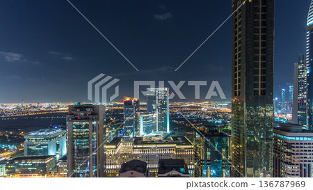 Dubai downtown architecture night timelapse. Top view over Sheikh Zayed road with illuminated skyscrapers and traffic. Dubai downtown architecture night timelapse. Top view over Sheikh Zayed road with illuminated skyscrapers and traffic. 136787969