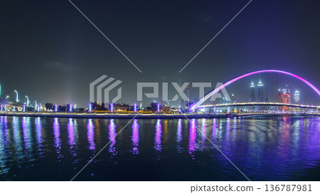 Pedestrian Bridge over the Dubai Water Canal day to night timelapse, United Arab Emirates Pedestrian Bridge over the Dubai Water Canal day to night timelapse, United Arab Emirates 136787981