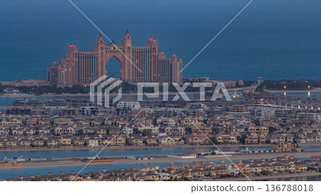Jumeirah Palm Island night to day timelapse dubai shot from the rooftop top of the tower in dubai marina, uae Jumeirah Palm Island night to day timelapse dubai shot from the rooftop top of the tower in dubai marina, uae 136788018