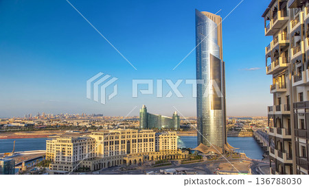 Modern Tower near Business bay crossing bridge timelapse, over the Dubai Creek, Dubai Modern Tower near Business bay crossing bridge timelapse, over the Dubai Creek, Dubai 136788030