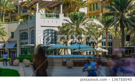 Fountain and palms timelapse at the Marina walk during day time. Dubai, UAE Fountain and palms timelapse at the Marina walk during day time. Dubai, UAE 136788040