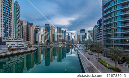 Dubai Marina towers and canal in Dubai night to day timelapse Dubai Marina towers and canal in Dubai night to day timelapse 136788043