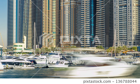 Close up view of Dubai Marina tallest towers in Dubai at day timelapse Close up view of Dubai Marina tallest towers in Dubai at day timelapse 136788044