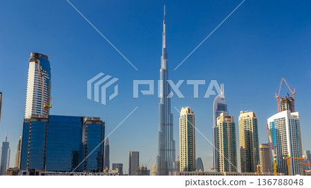 Skyline of Dubai's business bay with skyscrapers at day time timelapse 136788048