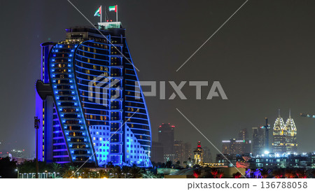 Hotel near Jumeirah beach night timelapse in Dubai, UAE. Hotel near Jumeirah beach night timelapse in Dubai, UAE. 136788058