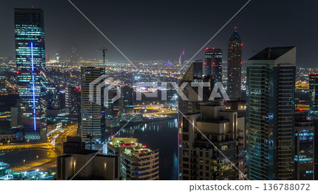 Aerial view of a big modern city at night timelapse. Business bay, Dubai, United Arab Emirates. Aerial view of a big modern city at night timelapse. Business bay, Dubai, United Arab Emirates. 136788072