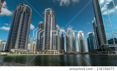 Residential buildings in Jumeirah Lake Towers timelapse in Dubai, UAE. Residential buildings in Jumeirah Lake Towers timelapse in Dubai, UAE. 136788073