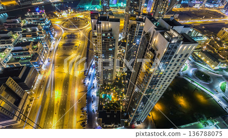 Aerial view of a big modern city at night timelapse. Business bay, Dubai, United Arab Emirates. 136788075
