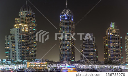 Promenade and canal in Dubai Marina timelapse at night, UAE. Promenade and canal in Dubai Marina timelapse at night, UAE. 136788078