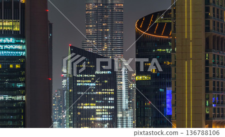 Dubai downtown architecture at night timelapse. Aerial view of numerous skyscrapers near Sheikh Zayed road. Dubai downtown architecture at night timelapse. Aerial view of numerous skyscrapers near Sheikh Zayed road. 136788106