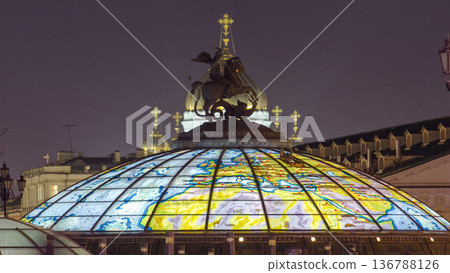 Glass cupola crowned by a statue of Saint George, patron of Moscow, at the Manege Square timelapse in Moscow, Russia 136788126