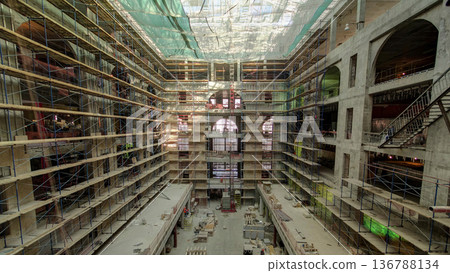 Construction equipment material with scaffolding and tools inside the floor of high rising building timelapse Construction equipment material with scaffolding and tools inside the floor of high rising building timelapse 136788134