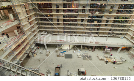 Construction equipment material with scaffolding and tools inside the floor of high rising building timelapse Construction equipment material with scaffolding and tools inside the floor of high rising building timelapse 136788135