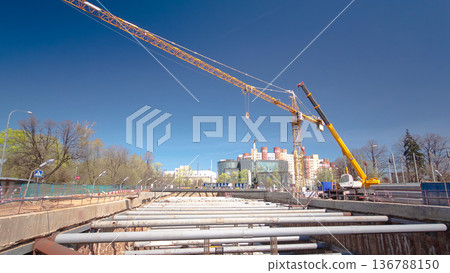 A large huge ditch pit tunnel timelapse hyperlapse at the construction site of the underground metro station line. A large huge ditch pit tunnel timelapse hyperlapse at the construction site of the underground metro station line. 136788150
