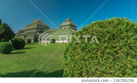 The Palmenhaus Schoenbrunn timelapse hyperlapse - a large greenhouse in the park Schoenbrunn in Vienna, Austria The Palmenhaus Schoenbrunn timelapse hyperlapse - a large greenhouse in the park Schoenbrunn in Vienna, Austria 136788236