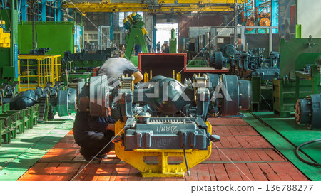 Conveyor assembly stage the body of tractor at big industrial factory timelapse Conveyor assembly stage the body of tractor at big industrial factory timelapse 136788277
