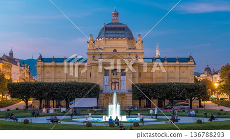 Day to night timelapse view of Art pavilion at King Tomislav square in Zagreb, Croatia. Day to night timelapse view of Art pavilion at King Tomislav square in Zagreb, Croatia. 136788293