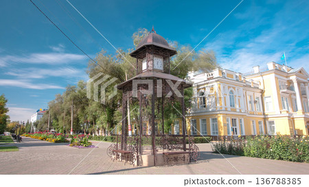 Beautiful park with clock on pavilion in the center of Uralsk timelapse hyperlapse. Western Kazakhstan. Beautiful park with clock on pavilion in the center of Uralsk timelapse hyperlapse. Western Kazakhstan. 136788385