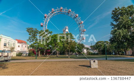 Wiener Riesenrad in Prater timelapse hyperlapse - oldest and biggest ferris wheel in Austria. Wiener Riesenrad in Prater timelapse hyperlapse - oldest and biggest ferris wheel in Austria. 136788447