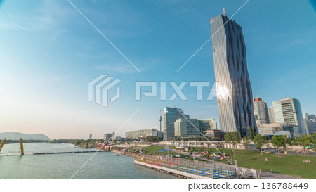 Donaustadt Danube City timelapse hyperlapse is a modern quarter with skyscrapers and business centres in Vienna, Austria. 136788449