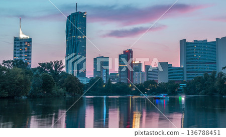 Vienna international center skyscrapers with Kaiserwasser lake reflection view day to night timelapse Vienna international center skyscrapers with Kaiserwasser lake reflection view day to night timelapse 136788451