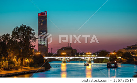 Seville skyline day to night timelapse with Torre Sevilla and Triana Bridge Seville skyline day to night timelapse with Torre Sevilla and Triana Bridge 136788514