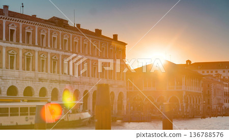 View of the deserted Rialto Market at sunset timelapse, Venice, Italy viewed from pier across the Grand Canal View of the deserted Rialto Market at sunset timelapse, Venice, Italy viewed from pier across the Grand Canal 136788576
