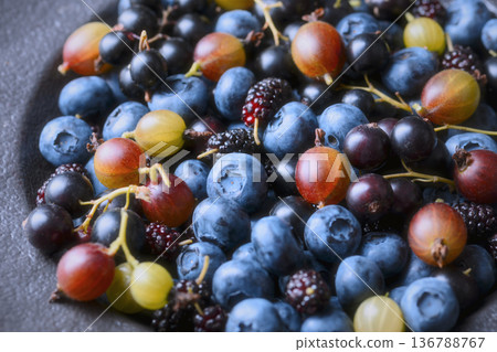 Assorted blue and green berries close perspective 136788767