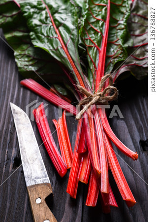 Fresh Swiss chard bunch with red stems Fresh Swiss chard bunch with red stems 136788827